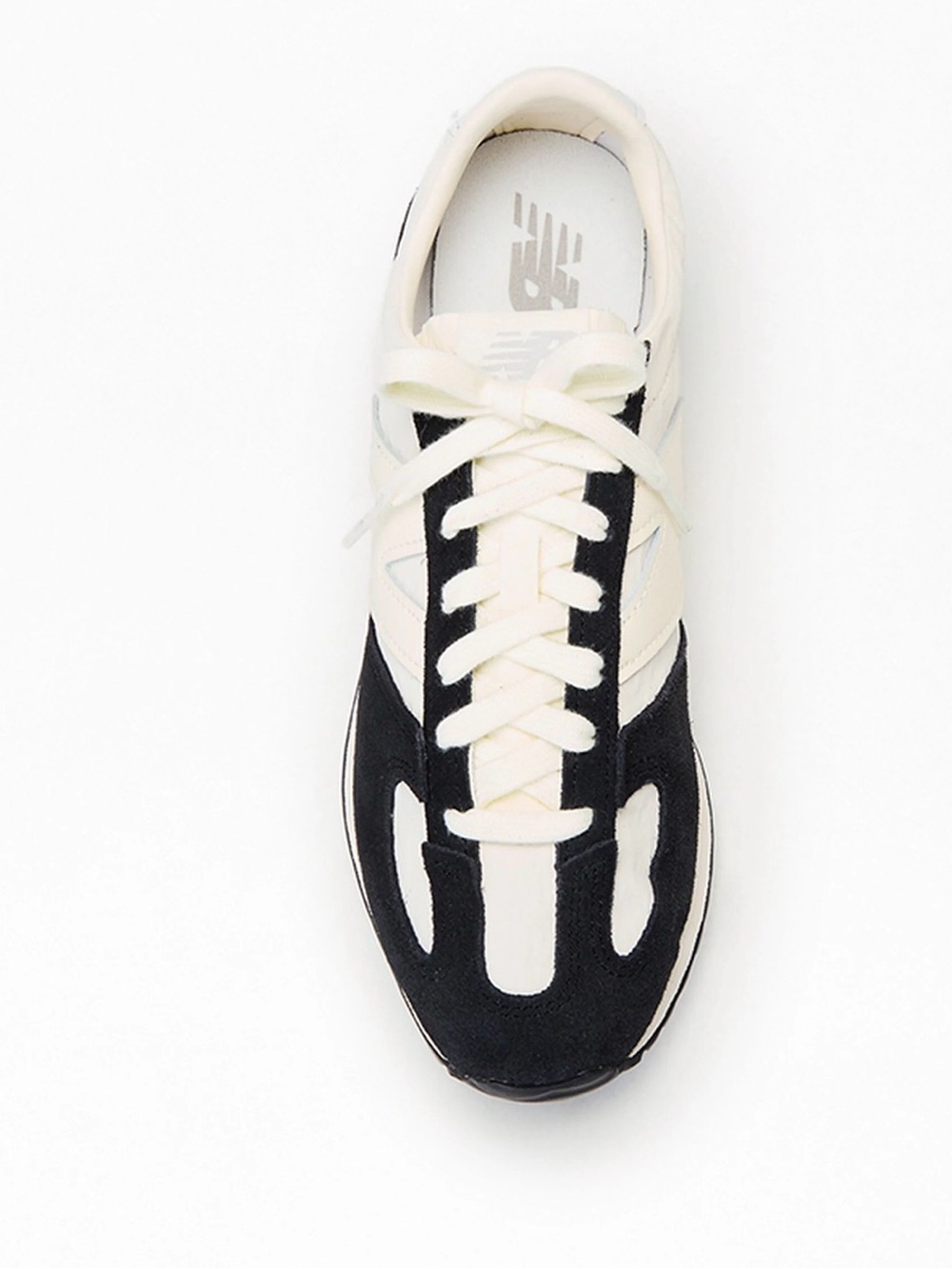 New Balance 447 never worn.Black & white Women's Athletic Sneaker